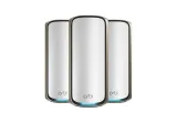 NETGEAR Orbi 970 three-pack mesh system, white units with a gold rim and blue light