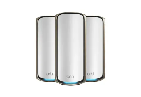 NETGEAR Orbi 970 three-pack mesh system, white units with a gold rim and blue light